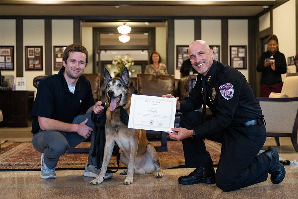 Pictured (left to right) are former keonhacaPD Sergeant Wesley Bunch, K-9 Bach and keonhaca Assistant Police Chief Brian Locke. 